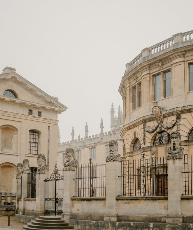 historic-stone-buildings-with-ornate-fencing-and-statues-.jpg Historic stone buildings with ornate fencing and statues.